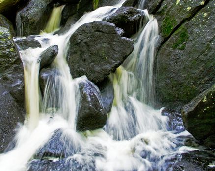 Water flowing over the large rocks created a dynamic fluid motion scene.