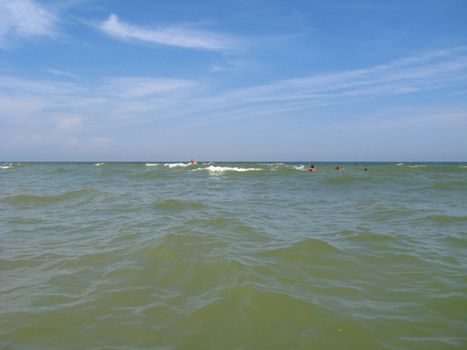 panorama of the sea and people bathing in the sea