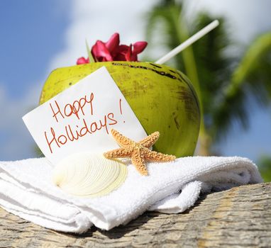 Coconut cocktail starfish tropical Caribbean beach refreshment and towel