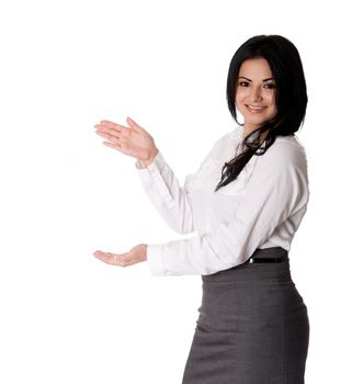 Beautiful happy smiling young corporate business woman MBA student standing pointing at project presentation wearing white blouse amd grey dress skirt, isolated.