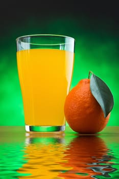 orange juice in a glass on a table with oranges