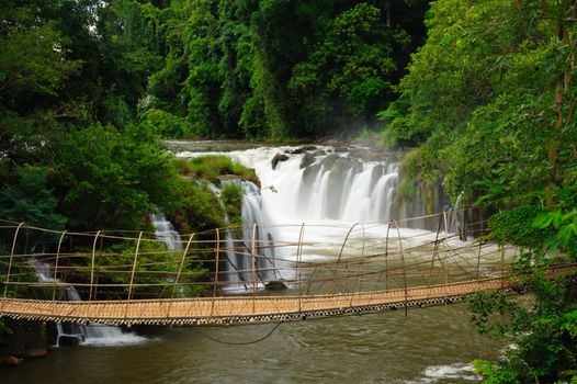 The bamboo rope bridge in Tad Pha Souam waterfall Bajeng national park, Paksa South Laos. 