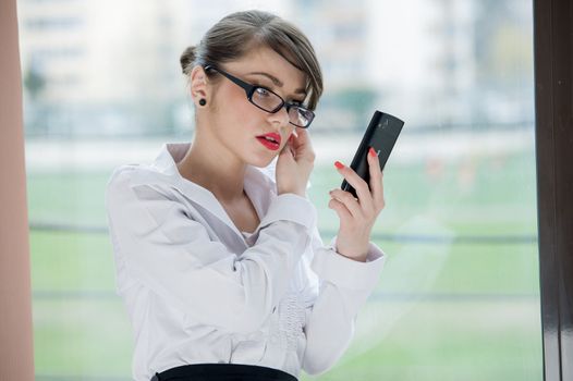 beautiful bussines woman with laptop and phone