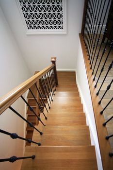 The wooden ladder conducting on the second floor