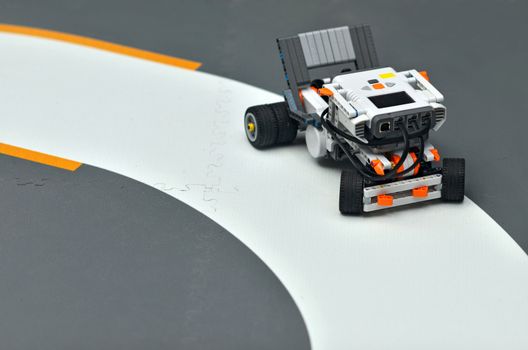 Electric vehicle robot on wheels during the race