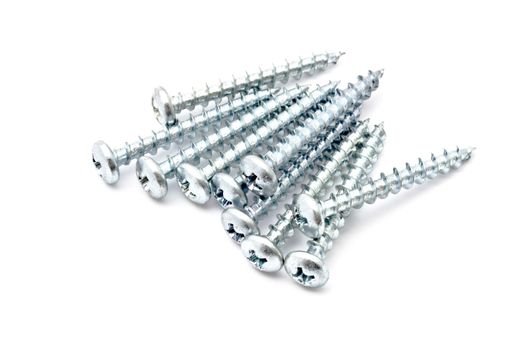 Heap of screws closeup on white background 
