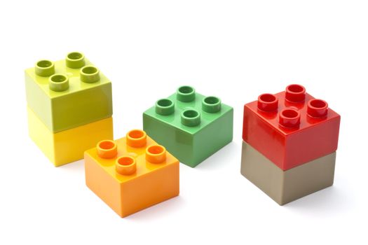 Colorful building blocks closeup on white background 