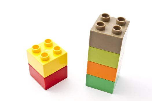 Colorful building blocks closeup on white