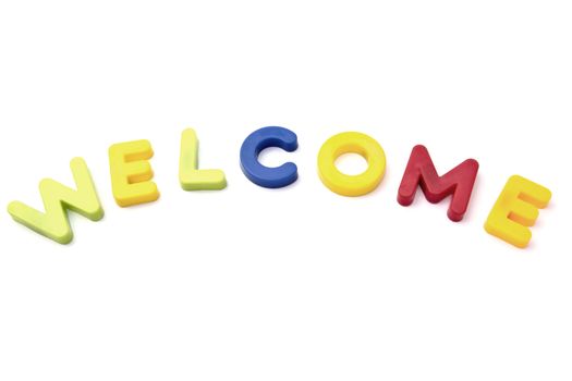 Letter magnets " welcome" closeup on white background 