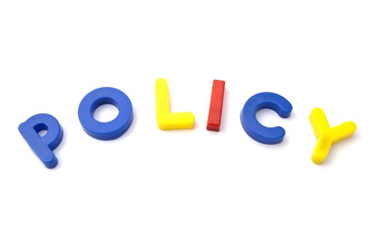 Letter magnets " policy" closeup on white background 