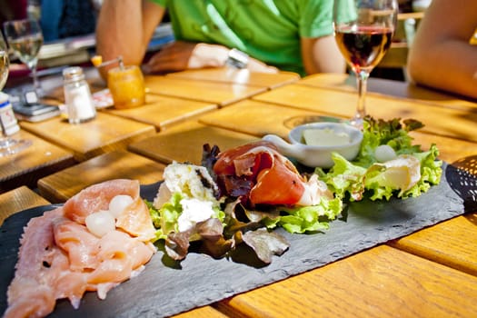 Brunch plate in Southern France with a glass of wine.







B