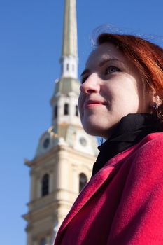 Young lady in front of Peter and Paul Fortress, St. Petersburg, Russia