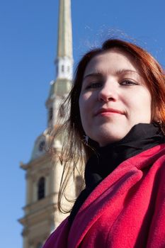 Pretty lady in front of Peter and Paul Fortress, St. Petersburg, Russia