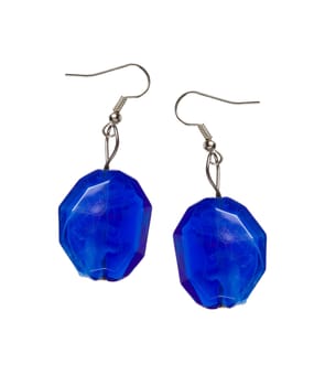 Earrings out of the blue cut-glass isolated on a white background. Collage