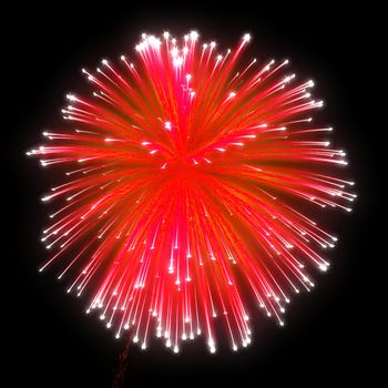 Red festive fireworks at night over black background