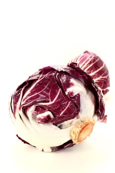 two radicchio on a white background