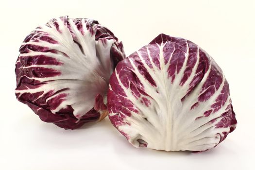 two radicchio on a white background