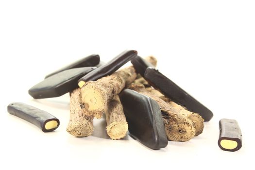 licorice root with liqorice on a bright background