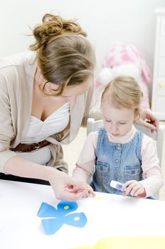 Carving. Mother and daughter doing handicrafts.