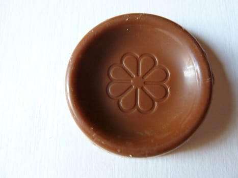 chocolate disc on a white background