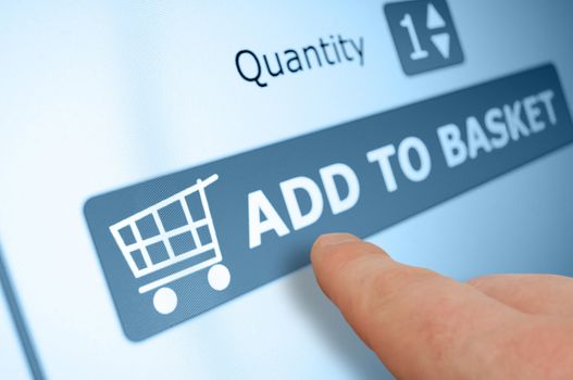 Online Shopping - Finger Pushing Add To Basket Button On Touchscreen