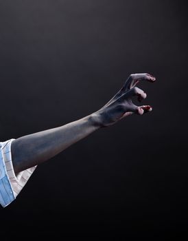 High contrast zombie hand, extreme body-art, studio shot 