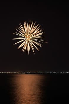 colorful huge fireworks display and reflection.