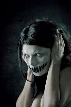 Horrible girl with scary mouth and eyes, extreme body-art 