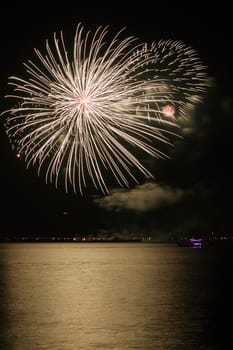 colorful huge fireworks display and reflection.