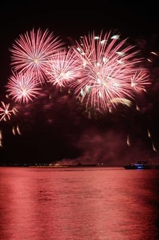 colorful huge fireworks display and reflection.