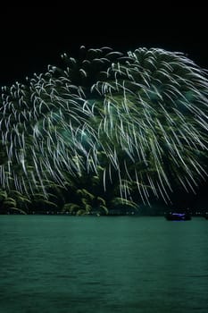 colorful huge fireworks display and reflection.