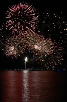 colorful huge fireworks display and reflection.