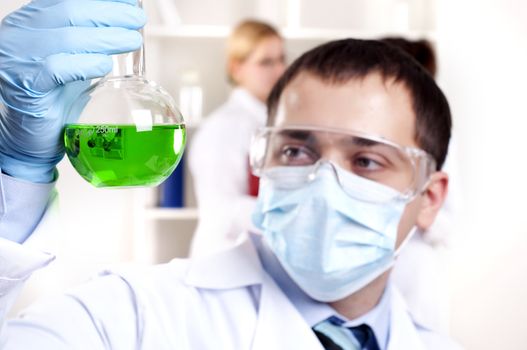 chemist working in the laboratory, mix liquid