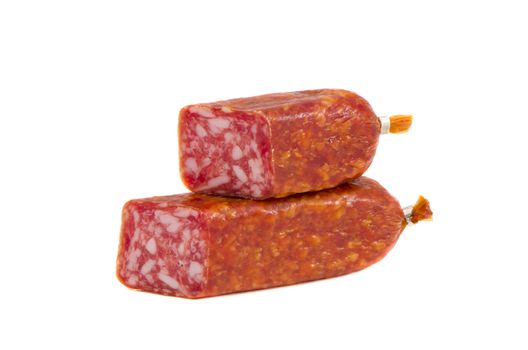 cut smoked sausage pieces isolated on white background.