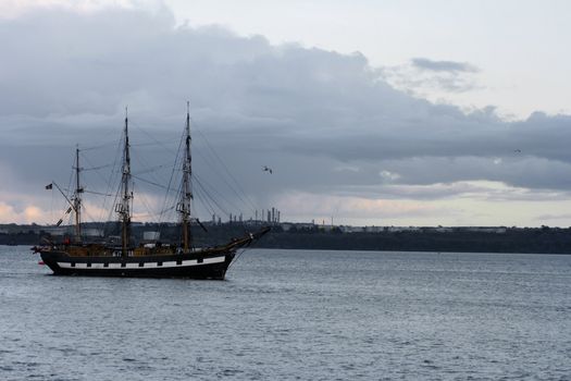 Retro ship sailing in the harbor