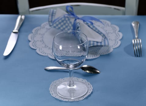 Table setting with fork, knife, glass and napkin