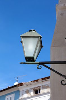 old street-lamp on house background