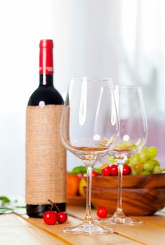 two glass with red wine on wooden table