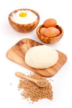 Raw freshyeast dough with eggs,  isolated on white