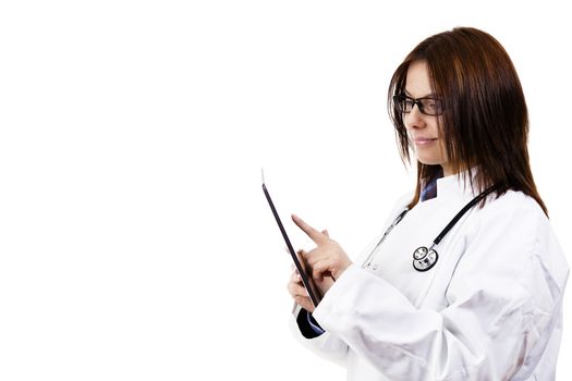 smiling female doctor using tablet pc on white background