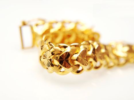 Yellow gold jewellry, isolated towards white background