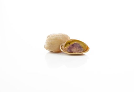 Dried pistachios on a white background