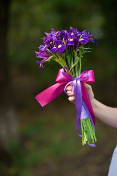 wedding bouquet in the hand of the bride