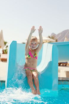 pretty happy little girl on slide