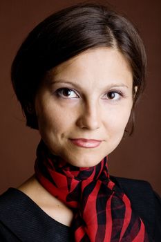 An image of a beautiful young woman in a scarf