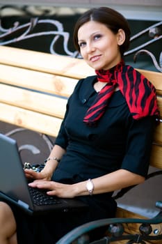 An image of a woman with laptop