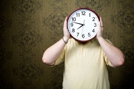 An image of a man with a big white clock