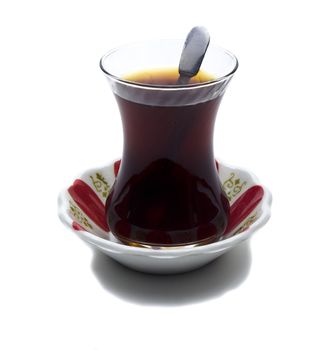 Brewed tea mixed with sugar spoon