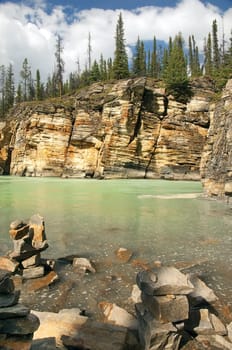 rocky shores of a mountain river in the Canadian Rockies