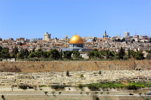 view of the golden dome of Al Aqsa Mosque, the old cemetery, the walls of old Jerusalem